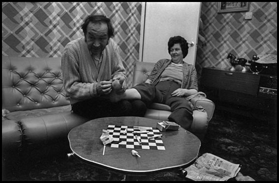 dad sanding mum's feet